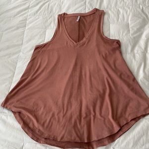 Woman’s soft, loose fitted, dusty rose top.